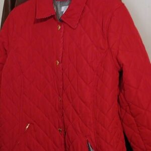 A puffer style coat, RED w/ blue & white checker lining